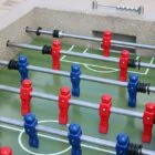 Foosball table with red and blue players.