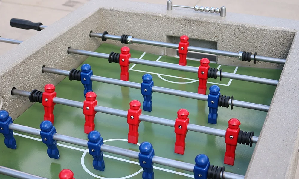 Foosball table with red and blue players.