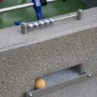 Frisbee golf game setup on a concrete surface.