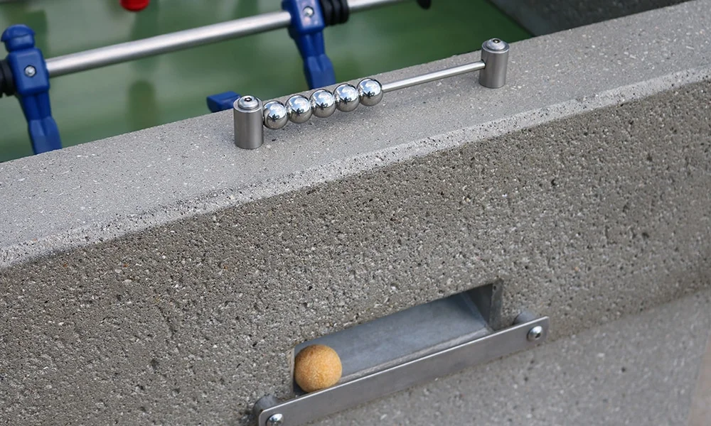 Frisbee golf game setup on a concrete surface.