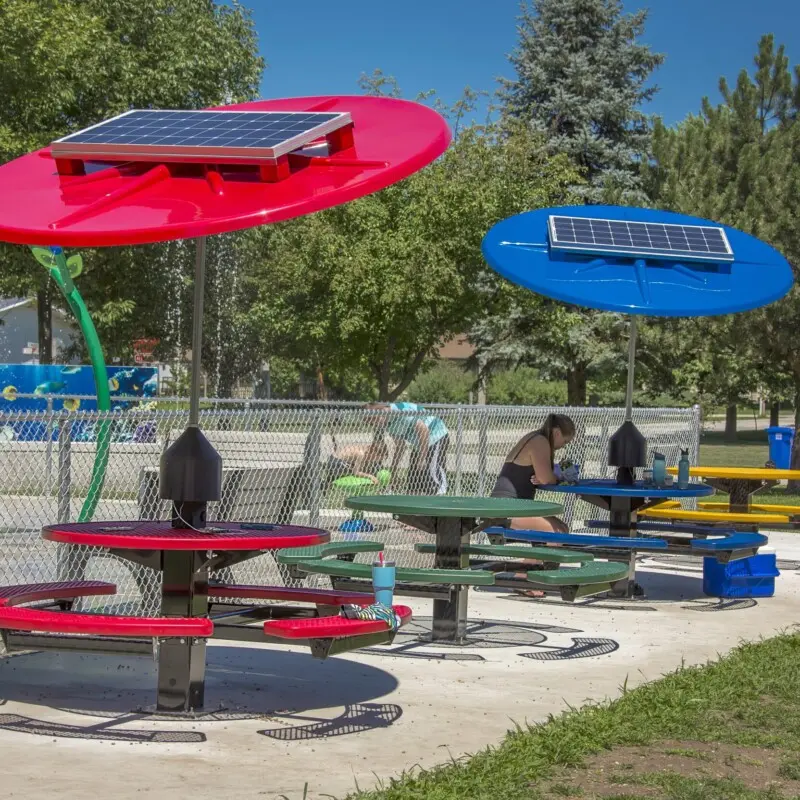 Solar-powered picnic tables in a park.