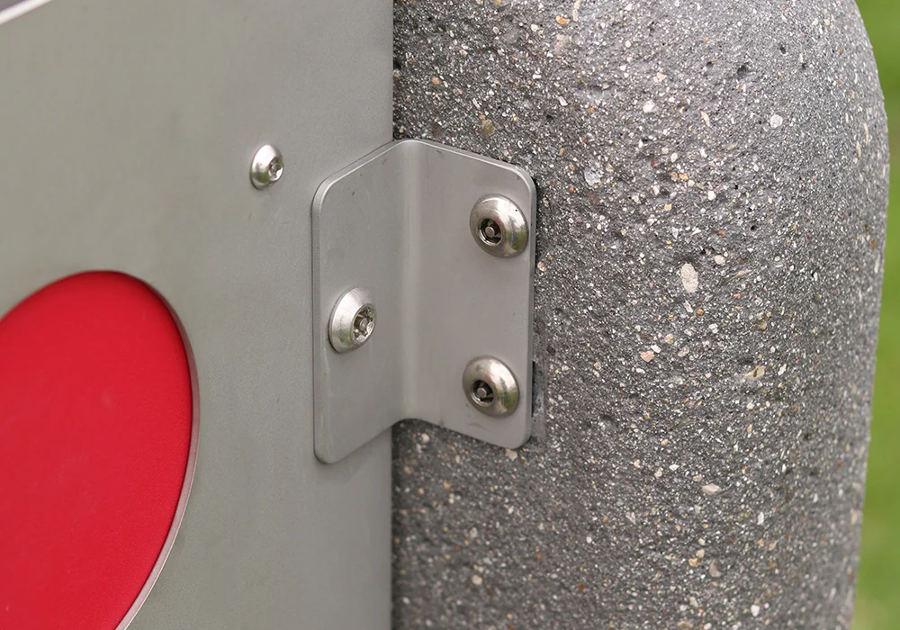 Metal bracket attached to concrete wall.