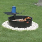 Fire pit with a blue kettle on top.