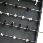 Foosball table rods and ball holders.