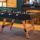 Foosball table in a cozy room.