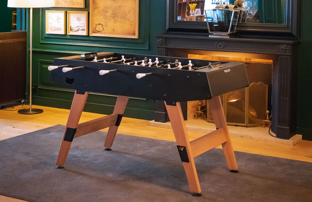 Foosball table in a cozy room.