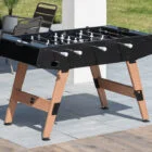 Outdoor foosball table on a patio.