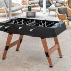 Outdoor foosball table in black and wood.