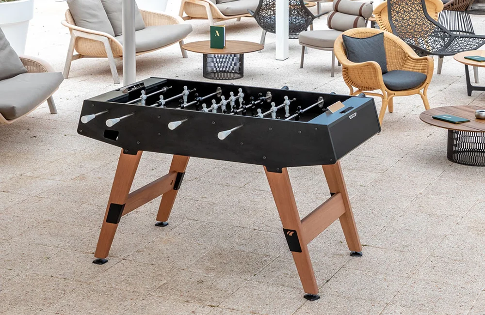 Outdoor foosball table in black and wood.