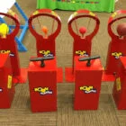 Red basketball arcade machines with handles and hoops.