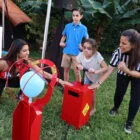 Woman and child playing at a carnival game.