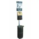 Pet waste station with sign and bag dispenser.