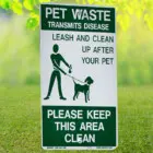 Pet waste sign on grass.