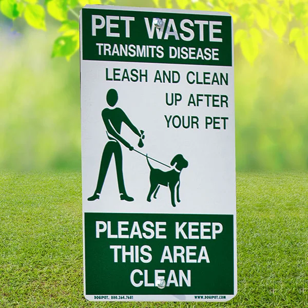 Pet waste sign on grass.