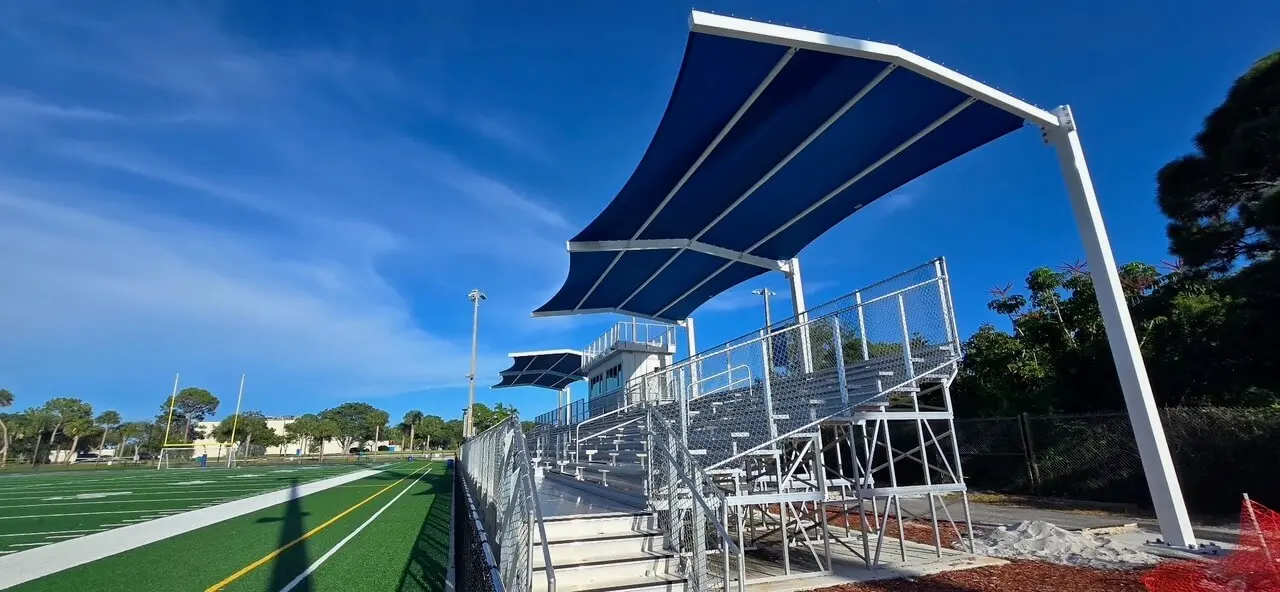 2-C-1-PR Sports field with bleachers and solar panels.