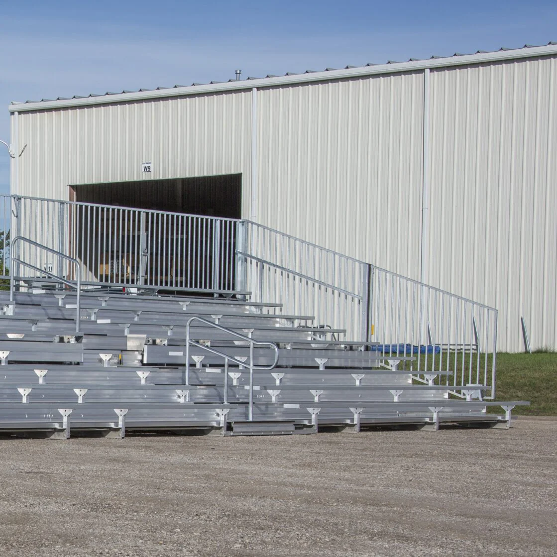 4509ROW075-scaled Metal bleachers in front of a building.