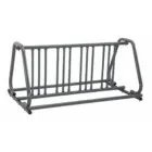 Gray metal bike rack on a white background.