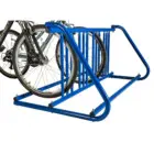 Blue bike rack holding two bicycles.
