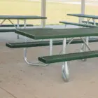 Outdoor picnic tables in a park setting.