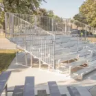 Metal bleachers in outdoor setting.