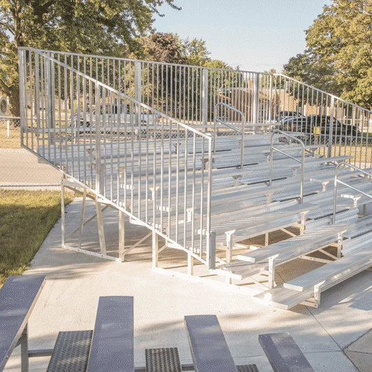 Metal bleachers in outdoor setting.