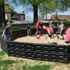Children playing in a playground area.