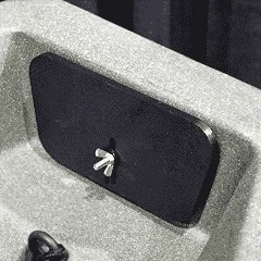 Black device in a white foam packaging.