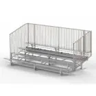 Metal bleachers with a railing.