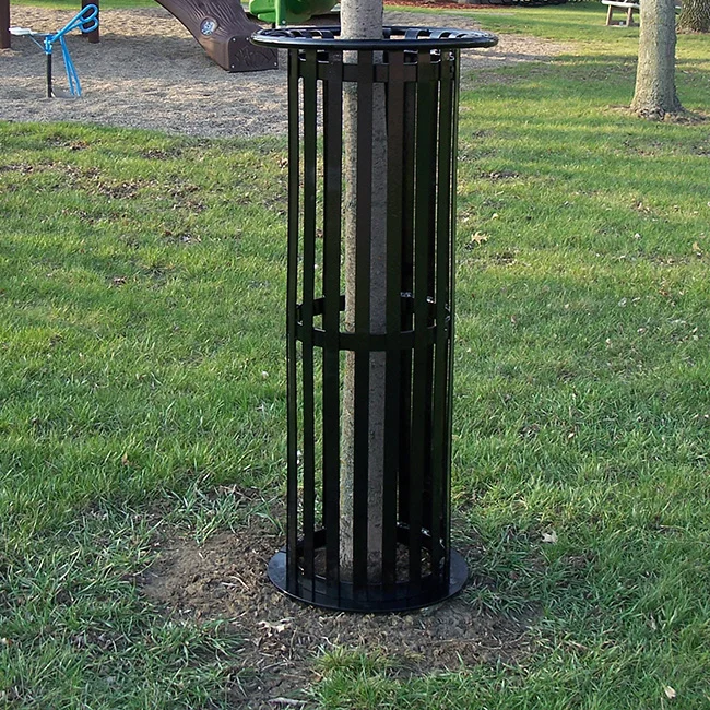 Black metal trash can in a park.