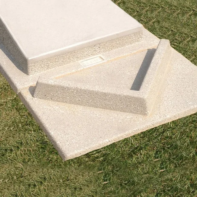 Concrete step on grass.
