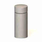 Concrete bollard light with a warm glow.