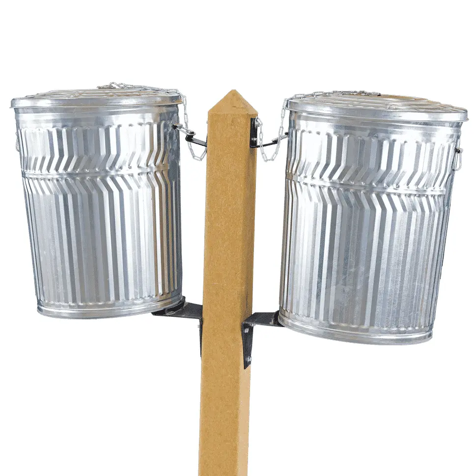 CPPRDwith32GcannLids Two metal trash cans hanging from a wooden post.