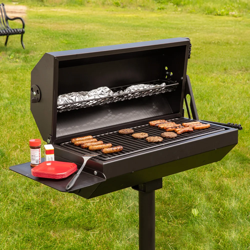ECG1929SCENE-53 Portable grill on grassy lawn.