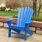 Blue Adirondack chair on a patio.