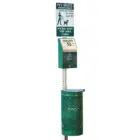 Pet waste station with sign and dispenser.