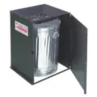 Metal trash can in a black metal enclosure.