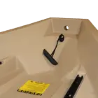 Beige bathtub with black handles and a yellow caution label.