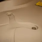 Toilet seat with warning label.