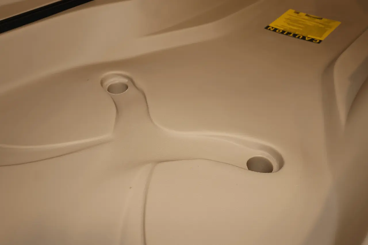 Toilet seat with warning label.