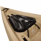Black gun holster on beige surface.