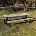 Outdoor picnic table in a park setting.