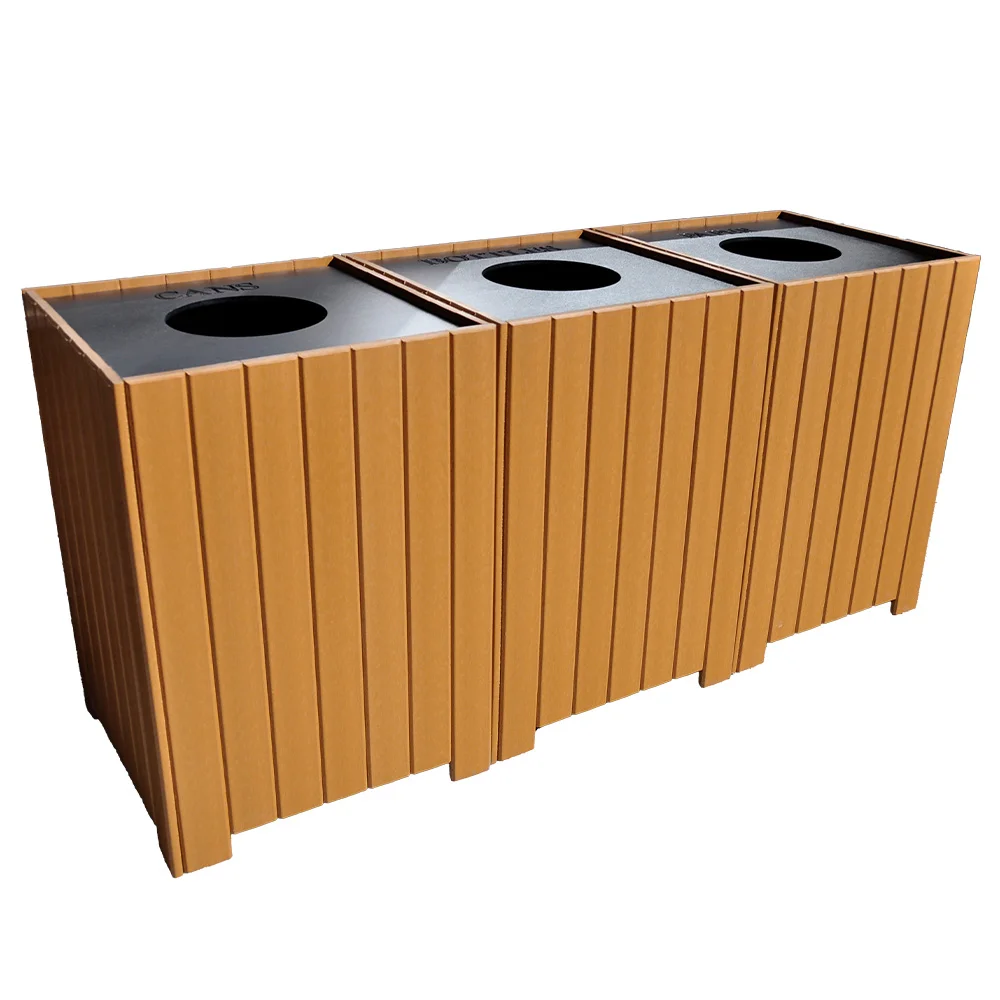 Recycling bin with three compartments.