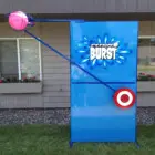 Pitch Burst game target stand in front of a house.
