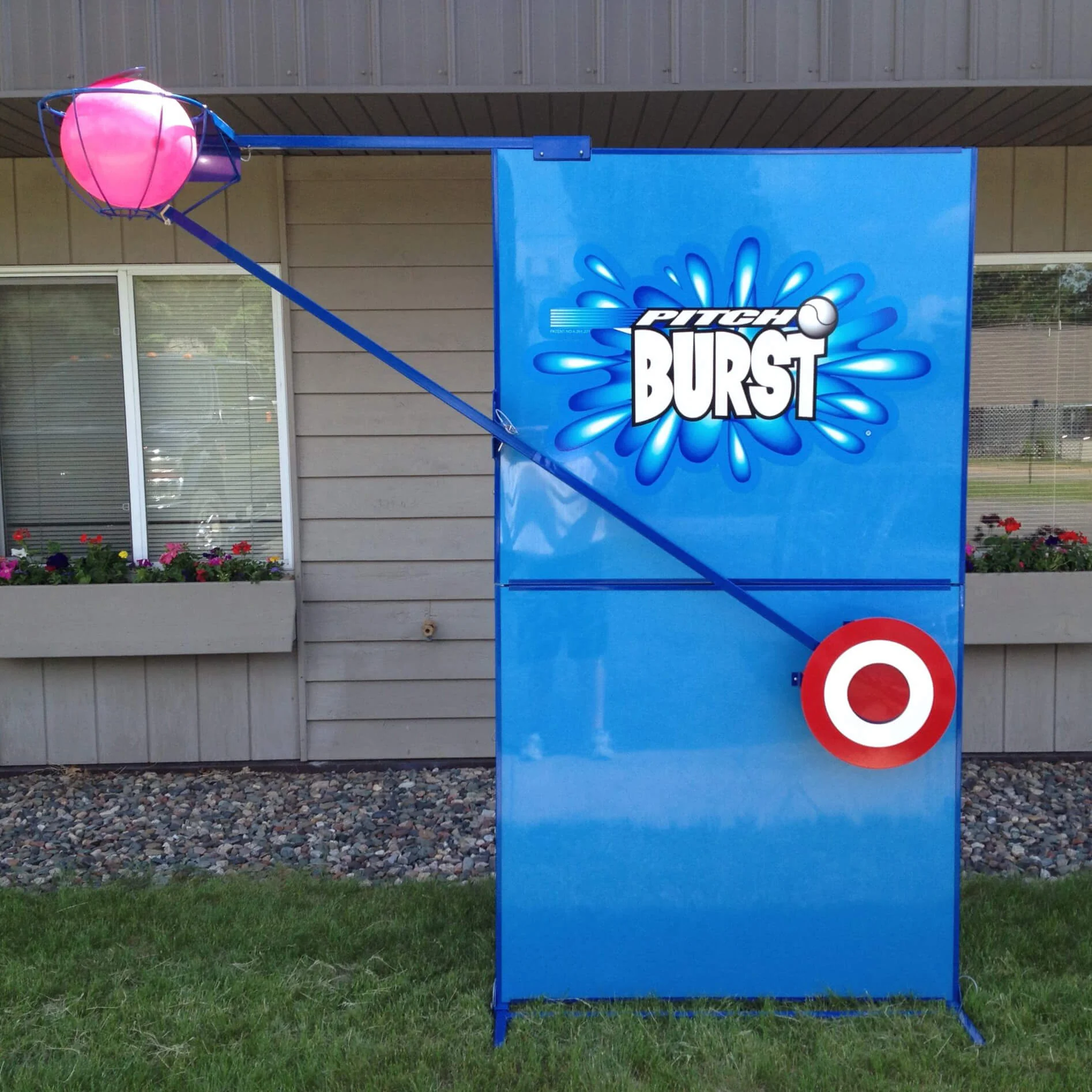 Pitchburst1-scaled-1 Pitch Burst game target stand in front of a house.