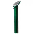 Solar-powered street light on a green pole.