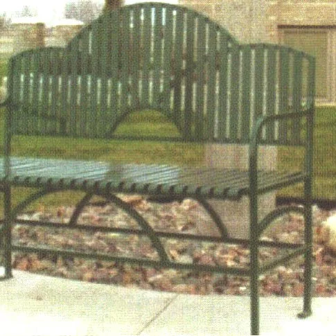 a0001193 Metal bench in a park setting.