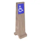 Handicap accessible sign on wooden post.