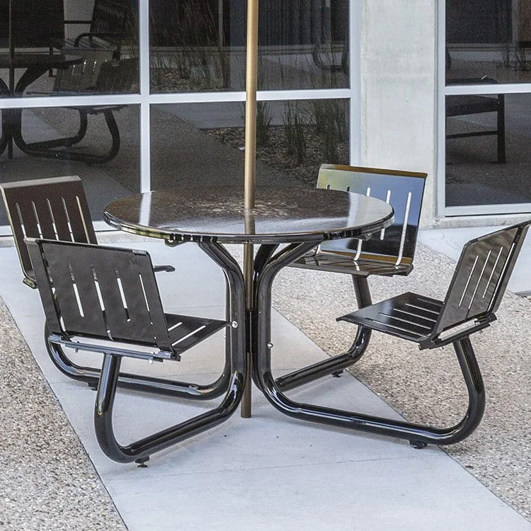 Outdoor patio furniture set with black metal chairs and a round table.