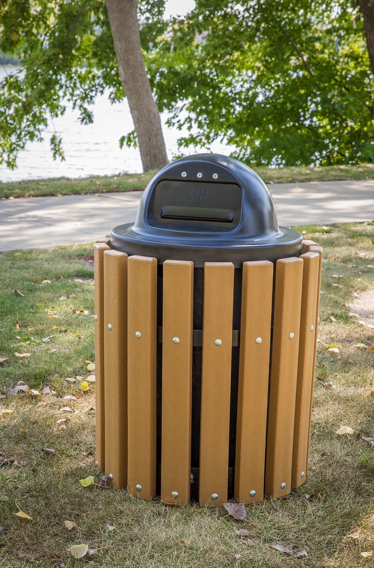 Outdoor trash can in a park setting.