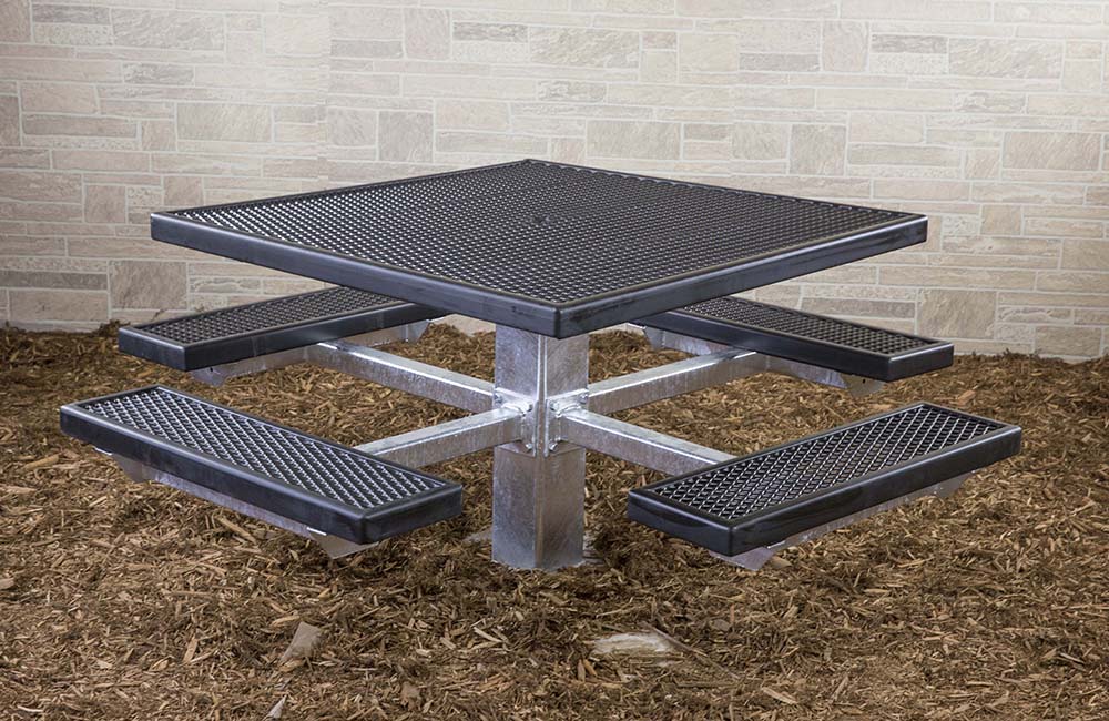Square metal picnic table with textured surfaces and a central pedestal.